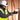 Person wearing a hard hat, safety glasses, high-visibility vest, and gloves in a construction setting.