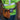 Person wearing a high-visibility safety vest with a tool belt and Klein Tools speaker attached to the belt.