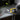 Person using pliers to handle electrical wires on a workbench